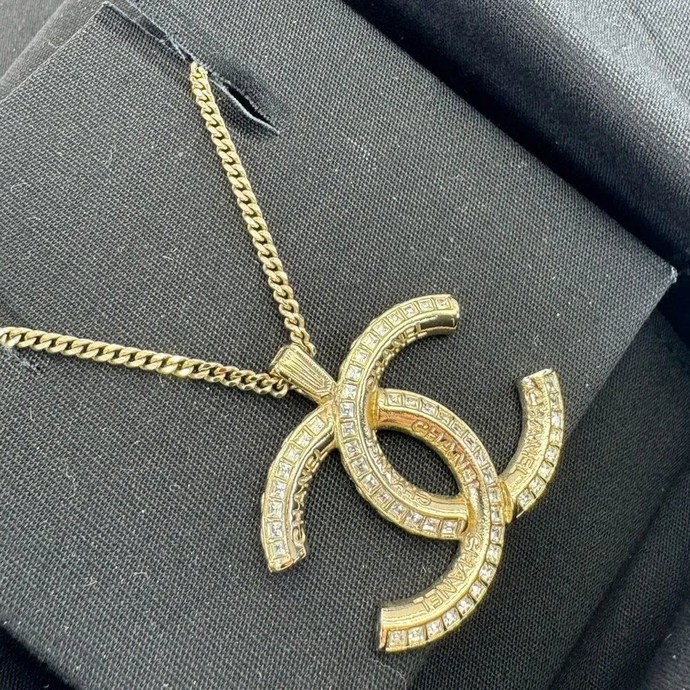 CHANEL Multi Logo Engraved Gold Crystal CC Pendant Necklace